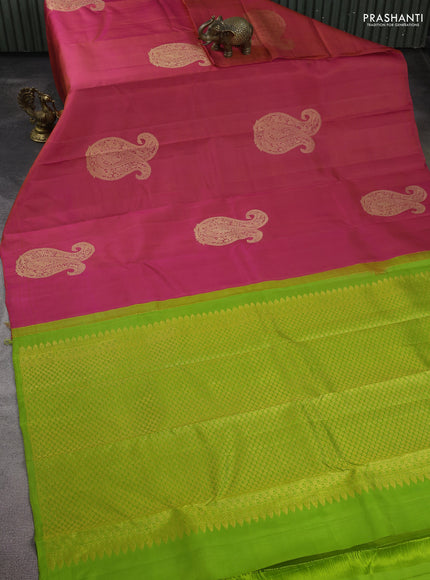 Pure kanchipuram silk saree dual shade of pinkish orange and light green with paisley zari woven buttas in borderless style