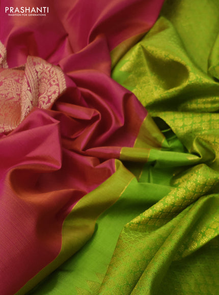 Pure kanchipuram silk saree dual shade of pinkish orange and light green with paisley zari woven buttas in borderless style