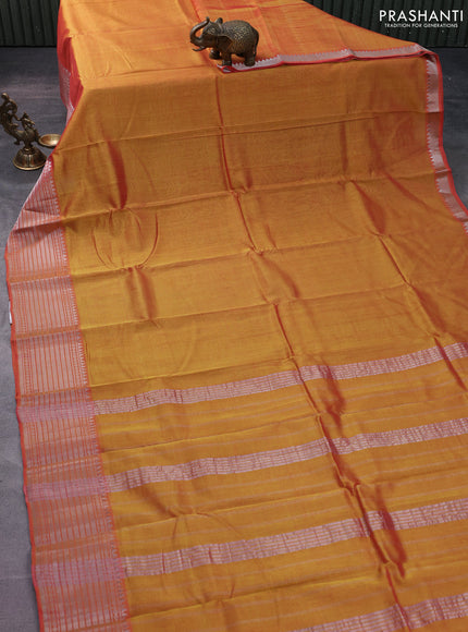 Mangalgiri silk cotton saree dual shade of yellowish oarnge and teal blue with palin body and silver zari woven border