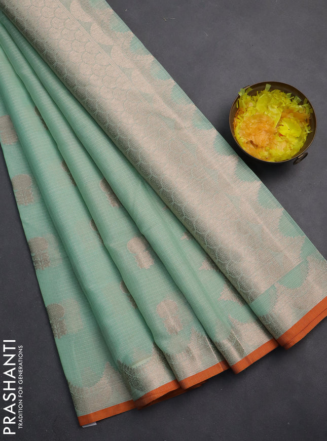 Cotton zari kota saree teal green and orange with zari woven floral buttas and piping border
