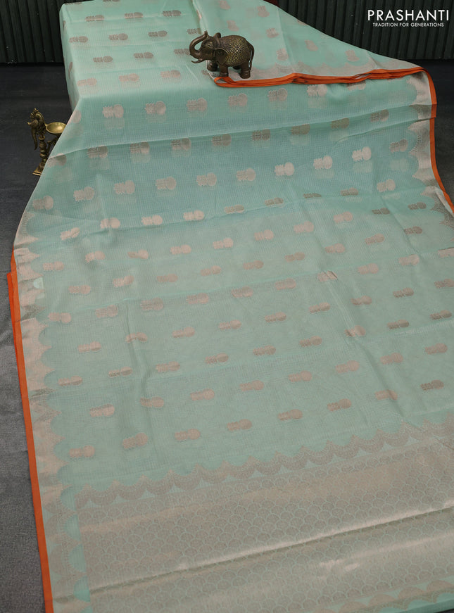 Cotton zari kota saree teal green and orange with zari woven floral buttas and piping border