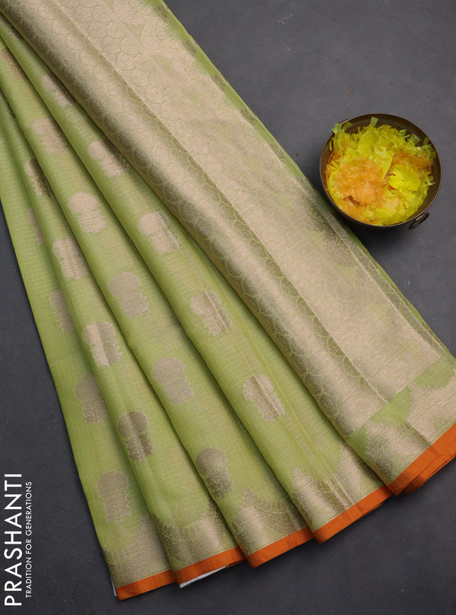 Cotton zari kota saree light green and orange with zari woven floral buttas and piping border
