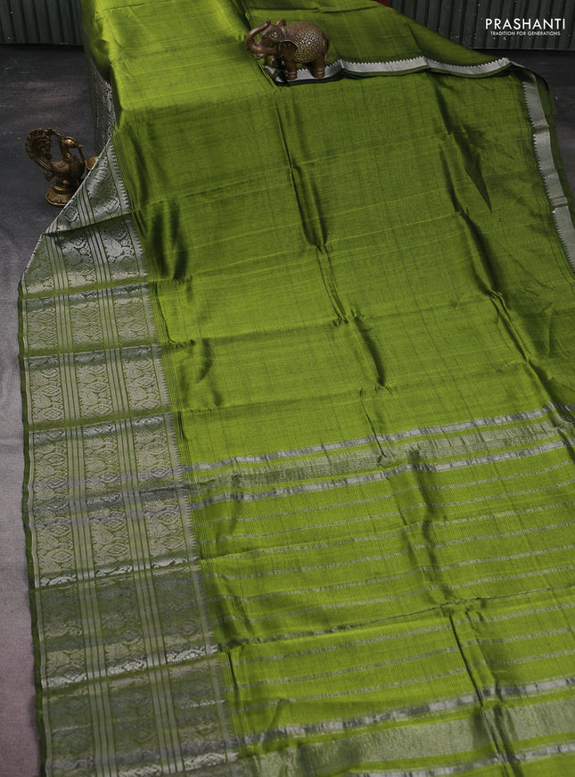 Mangalgiri silk cotton saree mehendi green and magenta pink with plain body and silver zari woven border