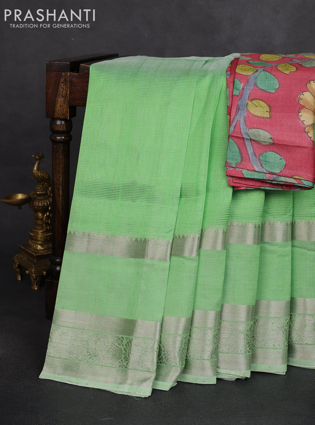 Mangalgiri silk cotton saree green shade and rust shade with plain body and long rettapet silver zari woven border