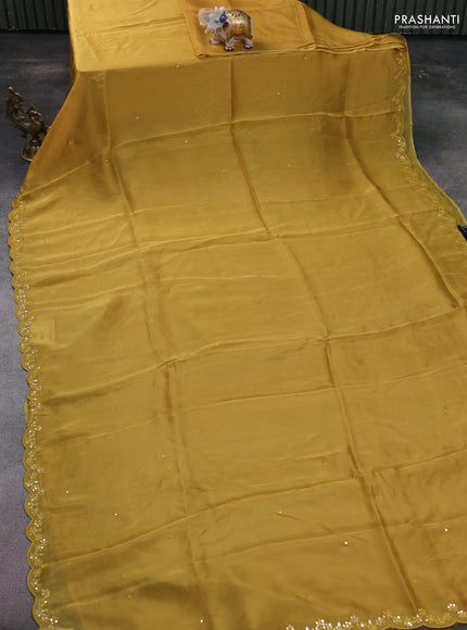 Satin crepe silk saree mustard yellow and black with mirror work and ajrakh printed blouse