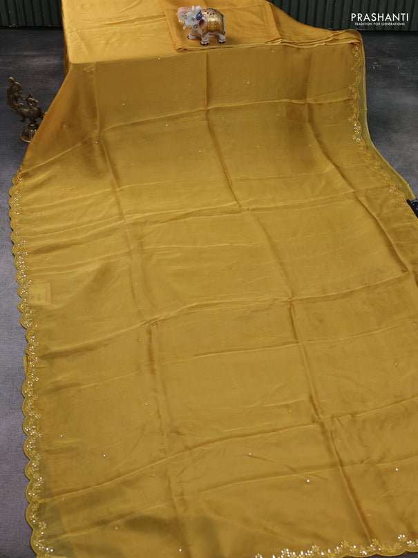 Satin crepe silk saree mustard yellow and black with mirror work and ajrakh printed blouse