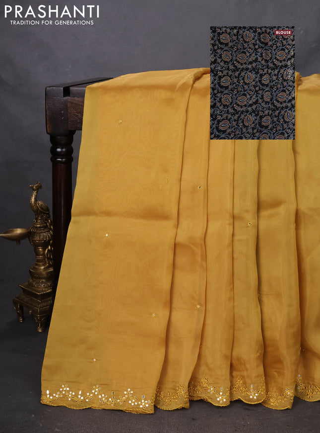 Satin crepe silk saree mustard yellow and black with mirror work and ajrakh printed blouse