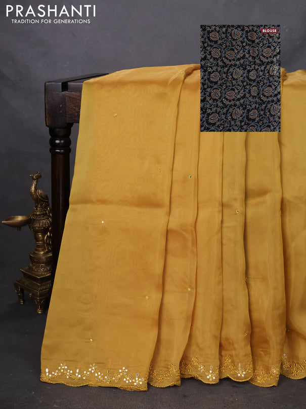 Satin crepe silk saree mustard yellow and black with mirror work and ajrakh printed blouse