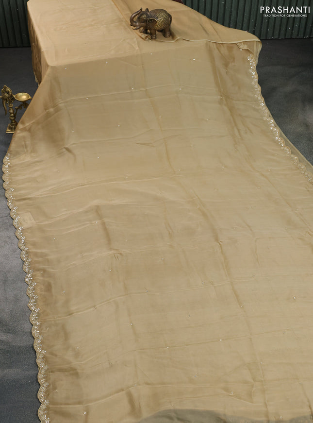 Satin crepe silk saree sandal and black with mirror work and ajrakh printed blouse