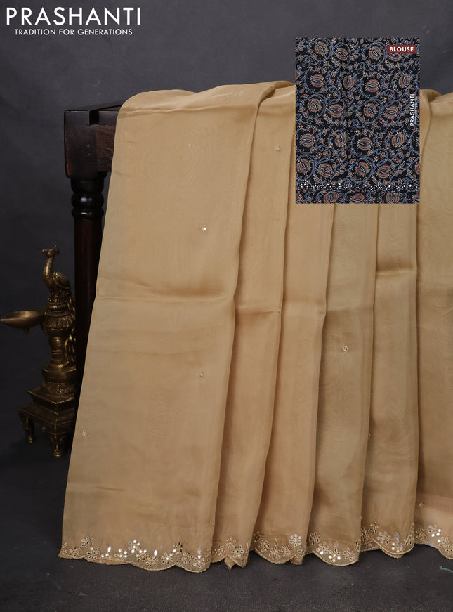 Satin crepe silk saree sandal and black with mirror work and ajrakh printed blouse