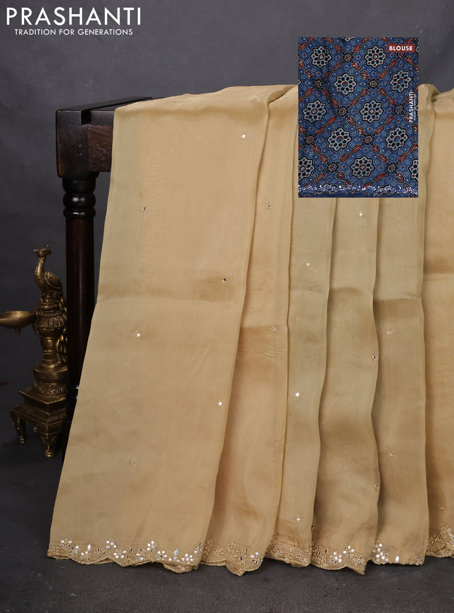 Satin crepe silk saree sandal and blue with mirror work and ajrakh printed blouse