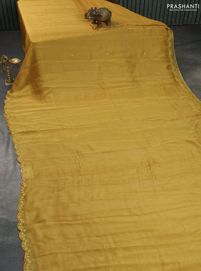 Satin crepe silk saree mustard yellow and green with mirror work and ajrakh printed blouse