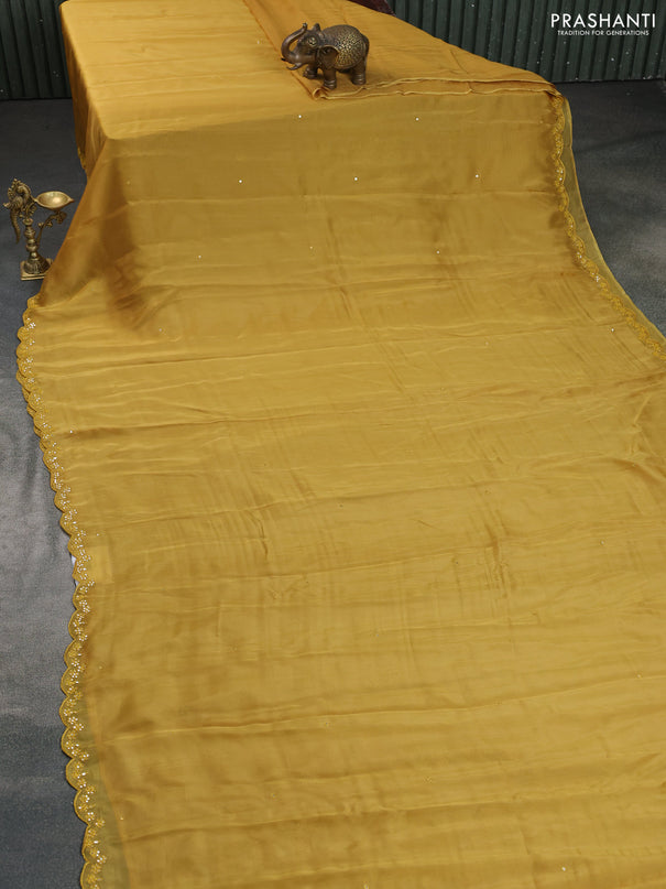 Satin crepe silk saree mustard yellow and green with mirror work and ajrakh printed blouse