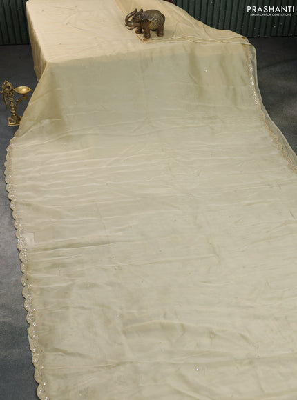 Satin crepe silk saree pale yellow and black with mirror work and ajrakh printed blouse