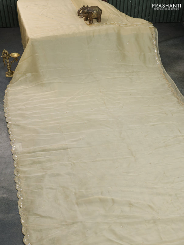 Satin crepe silk saree pale yellow and black with mirror work and ajrakh printed blouse