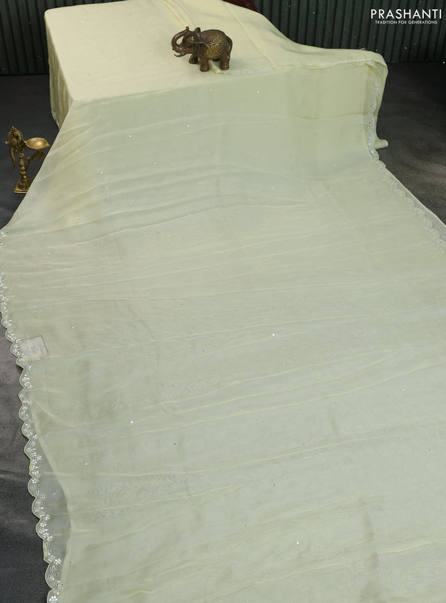 Satin crepe silk saree pale yellow and black with mirror work and ajrakh printed blouse