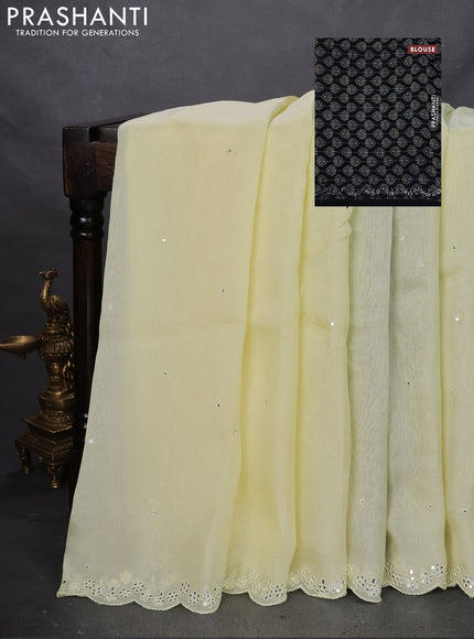 Satin crepe silk saree pale yellow and black with mirror work and ajrakh printed blouse