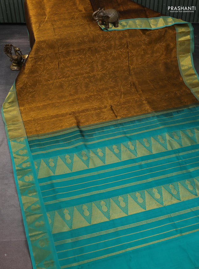 Silk cotton saree dark mustard and green with allover self emboss jacquard and zari woven border