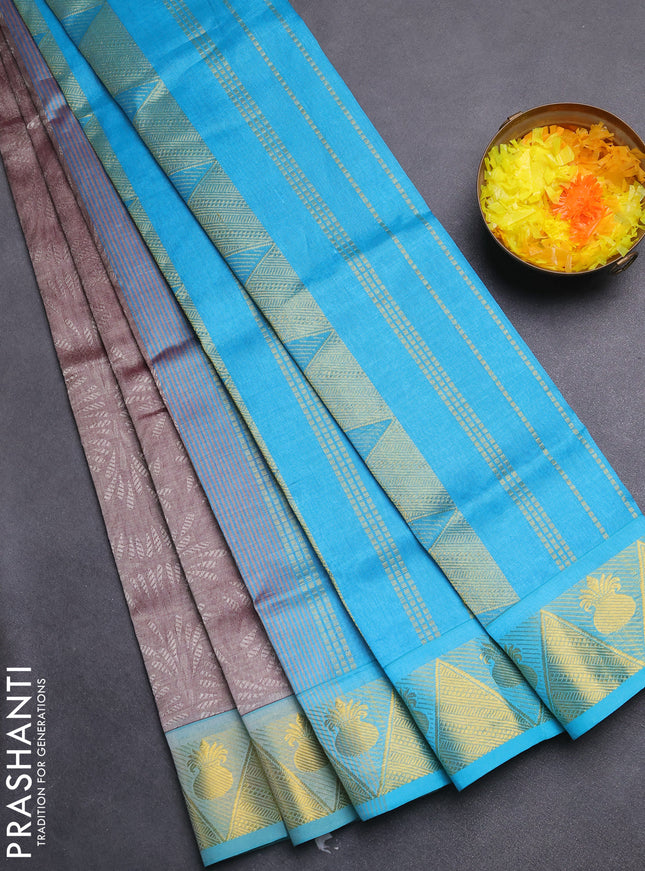 Silk cotton saree dual shade of grey and teal blue with allover self emboss jacquard and zari woven border