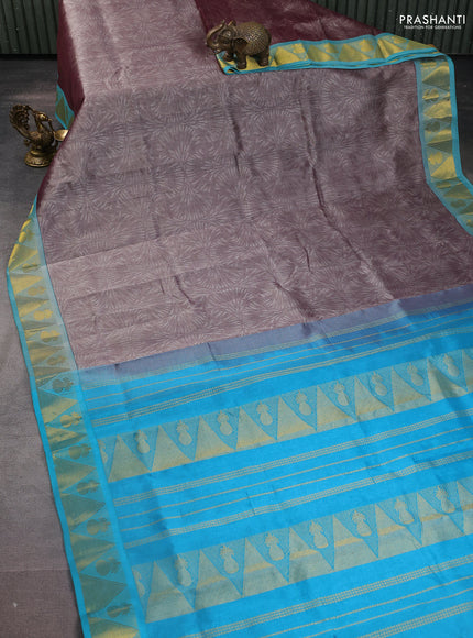 Silk cotton saree dual shade of grey and teal blue with allover self emboss jacquard and zari woven border
