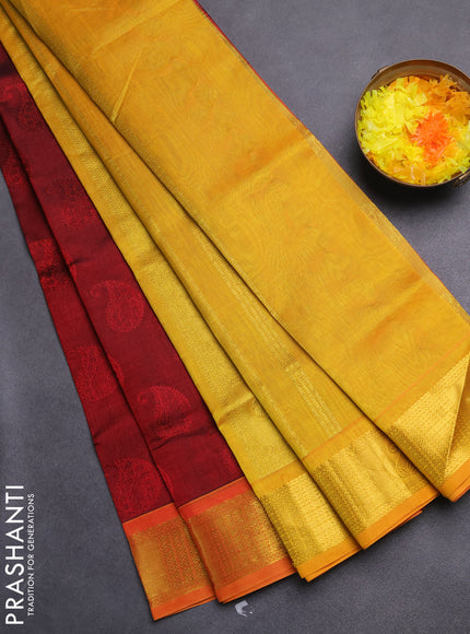 Silk cotton saree maroon and mustard yellow with allover self emboss jacquard and zari woven border