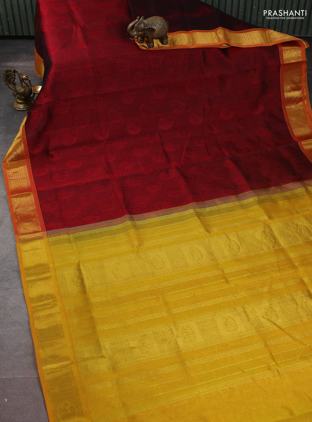 Silk cotton saree maroon and mustard yellow with allover self emboss jacquard and zari woven border