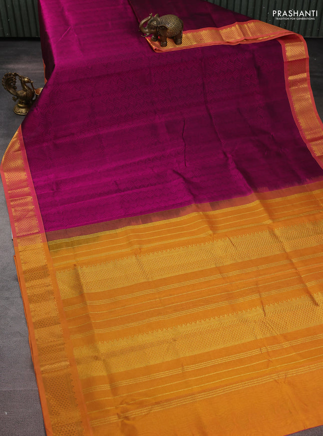 Silk cotton saree dark magenta pink and yellow with allover self emboss jacquard and zari woven border