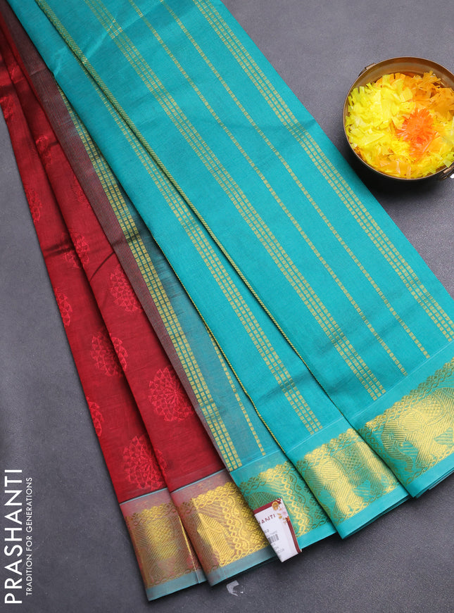 Silk cotton saree maroon and teal green with allover self emboss jacquard and zari woven border