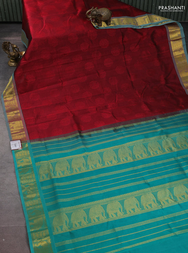 Silk cotton saree maroon and teal green with allover self emboss jacquard and zari woven border