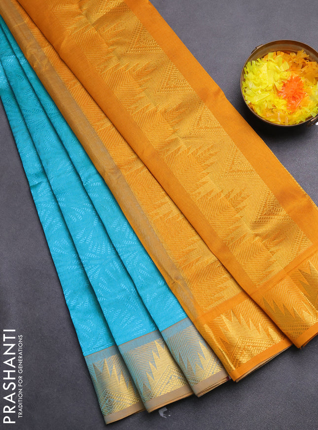 Silk cotton saree teal blue and mustard yellow with allover self emboss jacquard and zari woven border