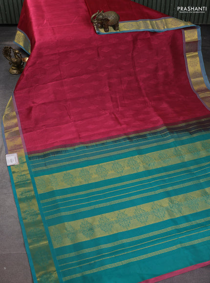 Silk cotton saree maroon and teal green with allover self emboss jacquard and zari woven border