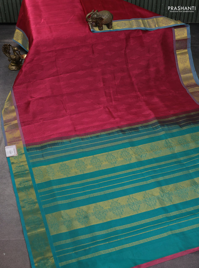 Silk cotton saree maroon and teal green with allover self emboss jacquard and zari woven border