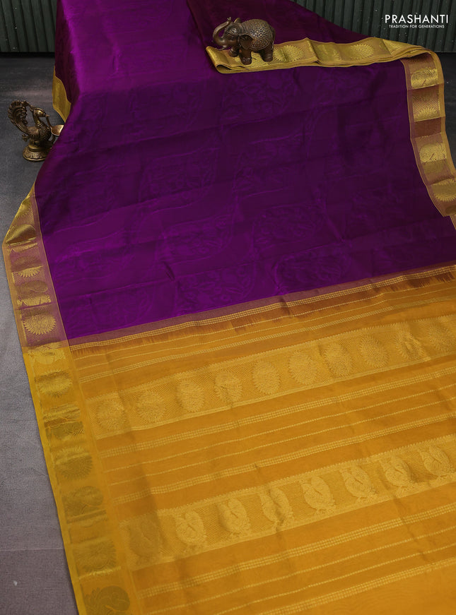 Silk cotton saree violet and mustard yellow with allover self emboss jacquard and zari woven border