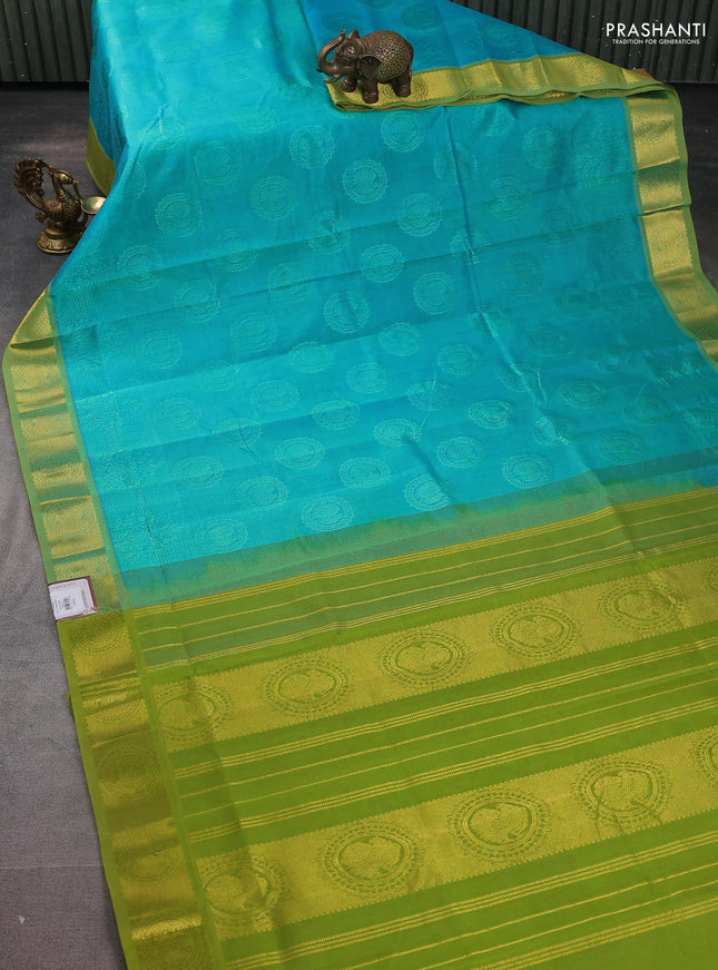 Silk cotton saree teal blue and light green with allover self emboss jacquard and zari woven border