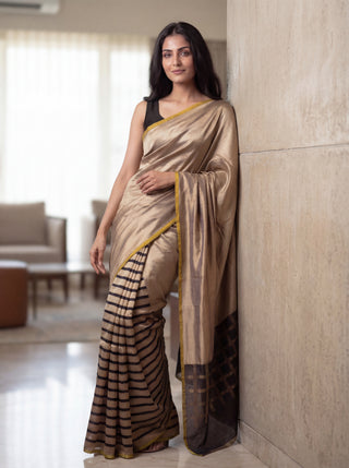 Banarasi tissue partly saree gold and black with plain body and piping border