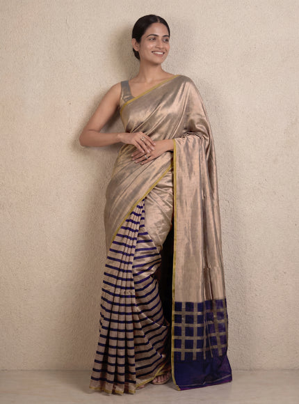 Banarasi tissue partly saree gold and navy blue with plain body and piping border