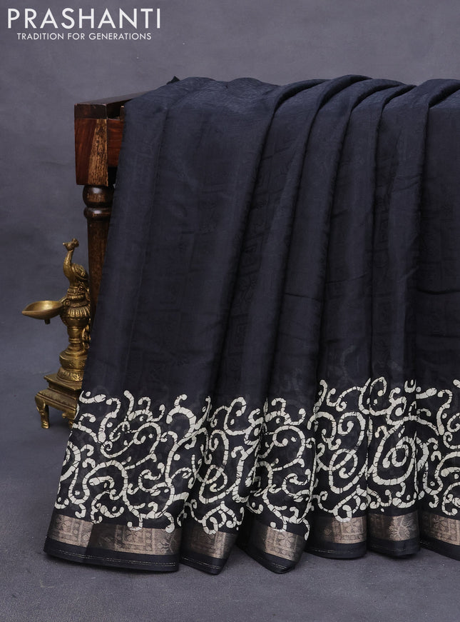 Semi crepe saree black with allover self emboss and batik printed border