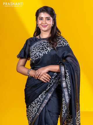 Semi crepe saree black with allover self emboss and batik printed border
