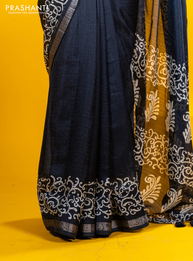 Semi crepe saree black with allover self emboss and batik printed border