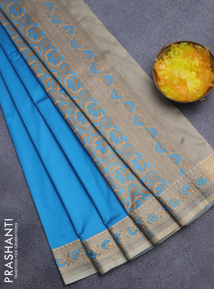 Semi banarasi katan saree cs blue and cream with plain body and zari woven border
