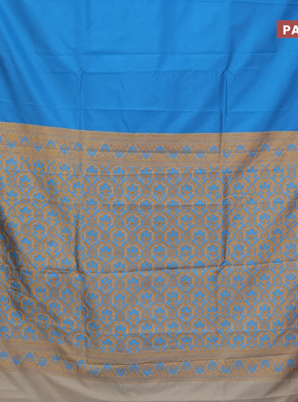 Semi banarasi katan saree cs blue and cream with plain body and zari woven border