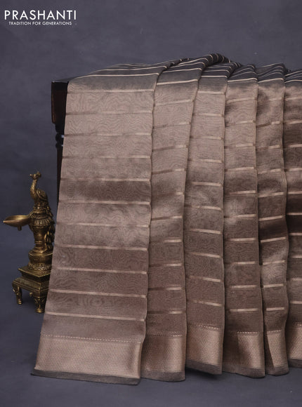 Tissue saree dual shade of grey and black with allover zari woven stripes pattern and zari woven border - printed blouse