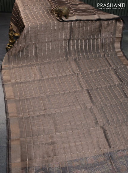 Tissue saree dual shade of grey and black with allover zari woven stripes pattern and zari woven border - printed blouse