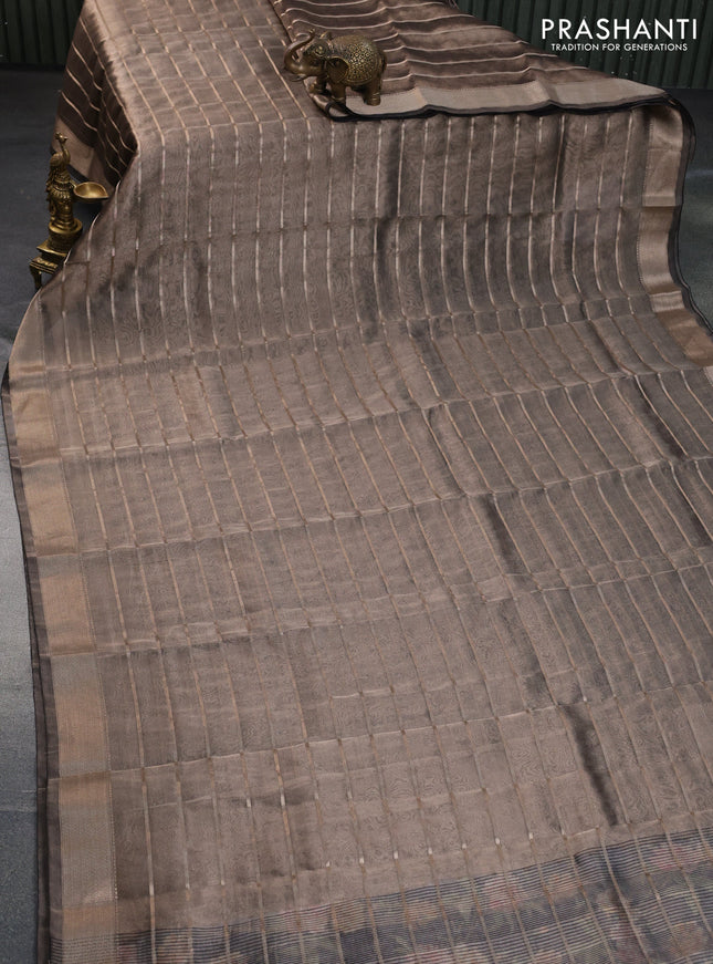 Tissue saree dual shade of grey and black with allover zari woven stripes pattern and zari woven border - printed blouse