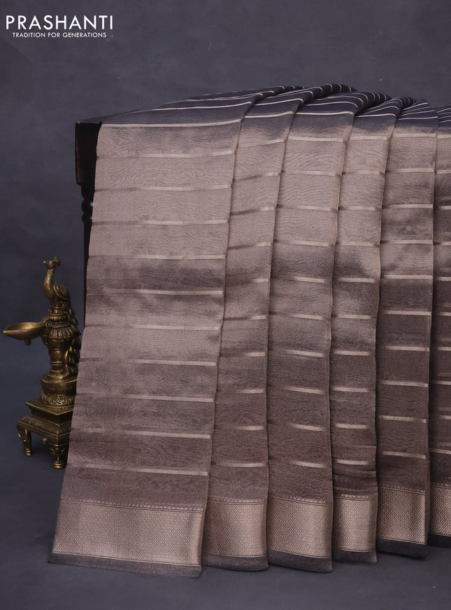 Tissue saree grey shade and blue with allover zari woven stripes pattern and zari woven border - printed blouse