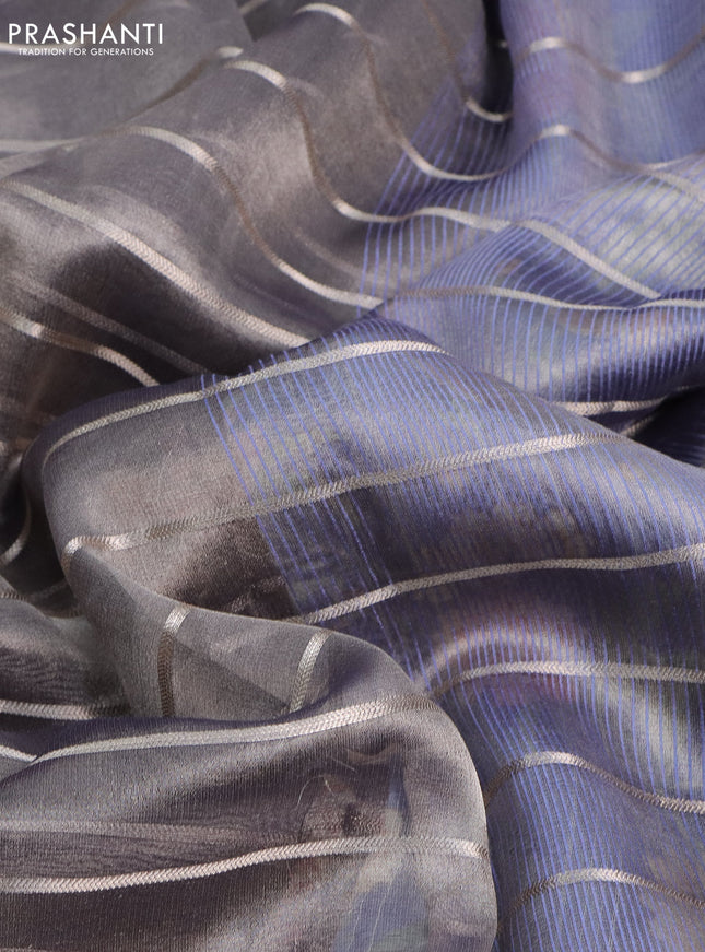 Tissue saree grey shade and blue with allover zari woven stripes pattern and zari woven border - printed blouse
