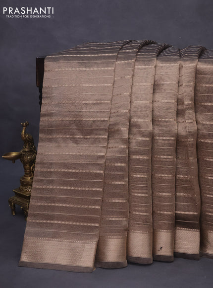 Tissue saree grey shade and black with allover zari woven stripes pattern and zari woven border - printed blouse