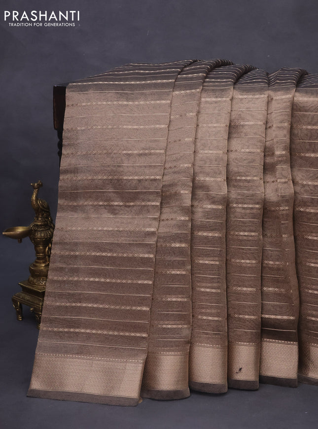 Tissue saree grey shade and black with allover zari woven stripes pattern and zari woven border - printed blouse