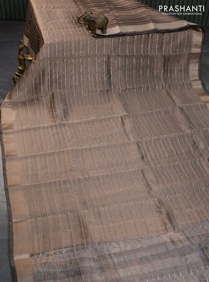 Tissue saree grey shade and black with allover zari woven stripes pattern and zari woven border - printed blouse