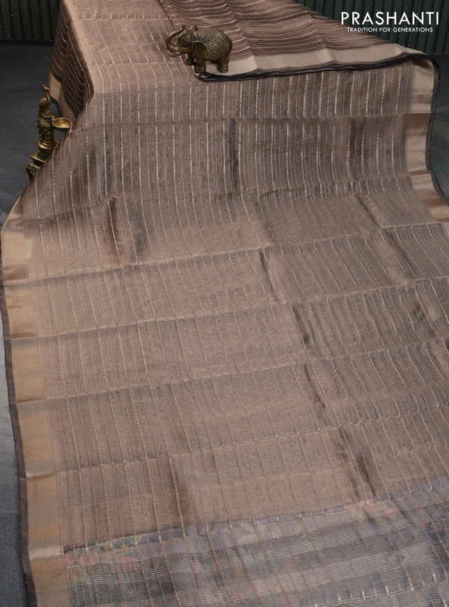 Tissue saree grey shade and black with allover zari woven stripes pattern and zari woven border - printed blouse